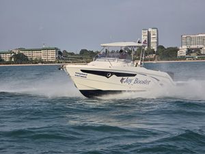 Galia 770 SUNDECK 2017 Galia 770 SUNDECK boat cruising near a coastal cityscape.