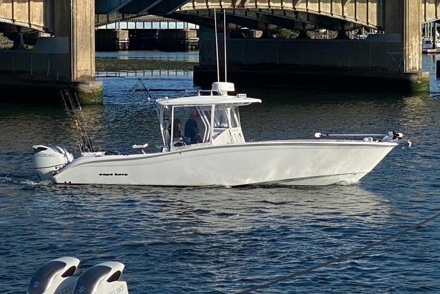 Cape Horn 32 XS 2023 Cape Horn 32 XS boat cruising under a bridge on calm water.