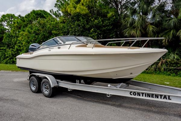 Scout 210 Dorado 2021 Scout 210 Dorado boat on trailer, parked outdoors.