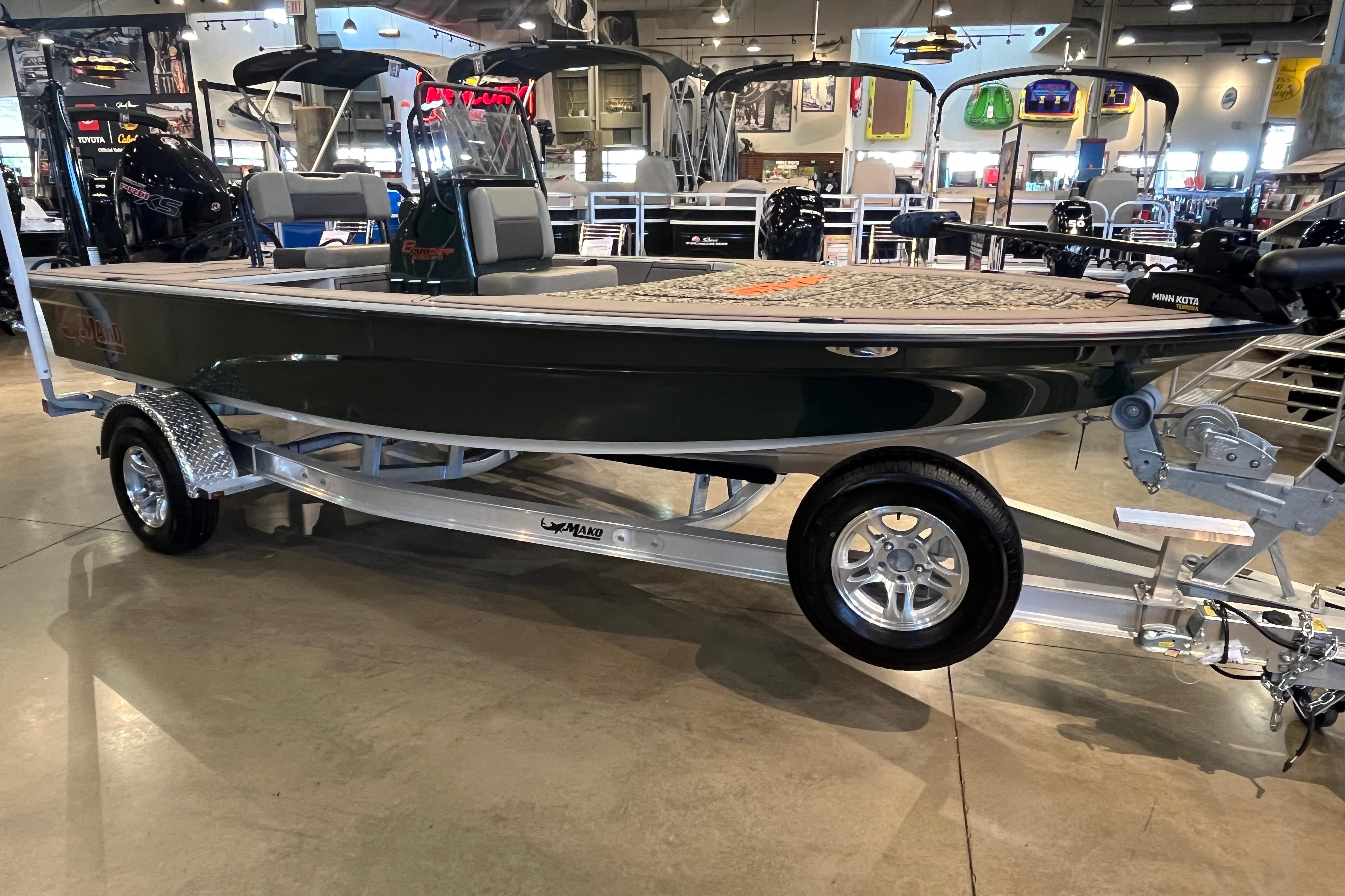 Mako 18 Pro Skiff Backwater Edition 2025 Mako 18 Pro Skiff Backwater Edition boat on display in showroom.