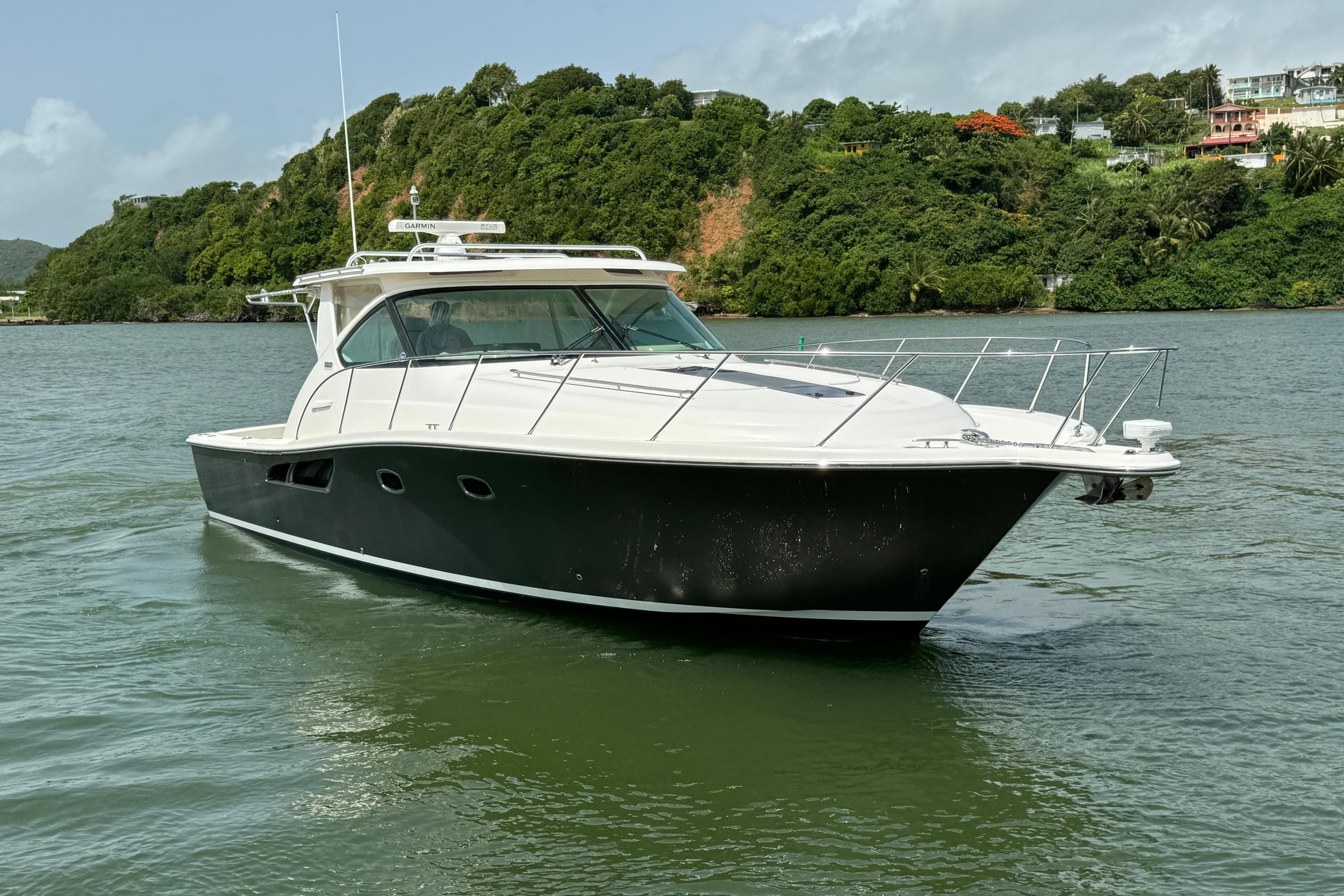 Tiara Yachts Coronet 3900 2015 Tiara Yachts Coronet 3900 cruising on a scenic waterway.