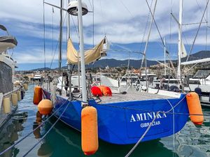 Comar Comet 62 RS 2020 Comar Comet 62 RS yacht docked in marina, vibrant blue hull, orange fenders.