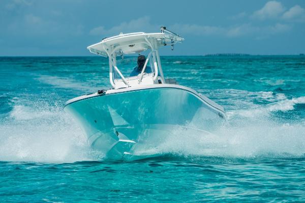 Edgewater 245CC Edgewater 245CC 2025 boat cruising on clear blue ocean waters.