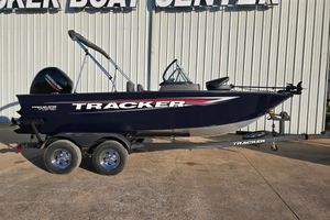 Tracker Pro Guide V-175 WT 2026 Tracker Pro Guide V-175 WT boat on trailer, parked outside a boat center.