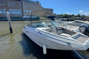 Crownline Eclipse E235 XS 2022 Crownline Eclipse E235 XS boat docked in a marina, sunny day.