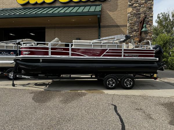 Ranger Reata 220F 2024 Ranger Reata 220F pontoon boat displayed outside a store.
