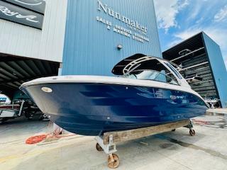 Sea Ray SDX 250 Outboard 2026 Sea Ray SDX 250 Outboard boat displayed at a marine dealership.
