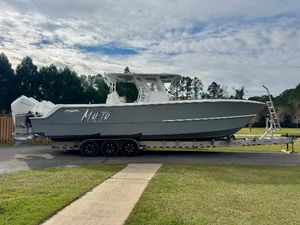 Invincible 35 Catamaran 2022 Invincible 35 Catamaran on trailer, parked outdoors with cloudy sky backdrop.