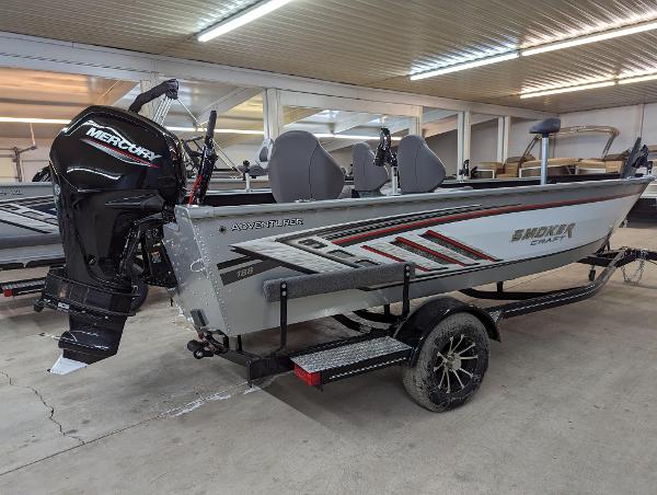 Smoker Craft Adventurer 188 T 2023 Smoker Craft Adventurer 188 T boat with Mercury outboard motor in showroom.