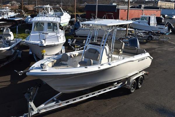 Key West 239 FS 2024 Key West 239 FS boat on trailer in marina setting.