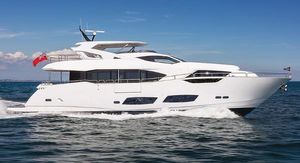Sunseeker 95 2017 Sunseeker 95 yacht cruising on open water under clear blue skies.