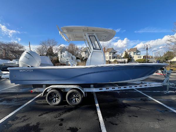 Sea Fox 251 Bay Fox 2024 Sea Fox 251 Bay Fox boat on trailer, parked outdoors under blue sky.