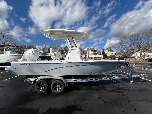 Sea Fox 231 Bay Fox 2024 Sea Fox 231 Bay Fox boat on trailer under blue sky with clouds.