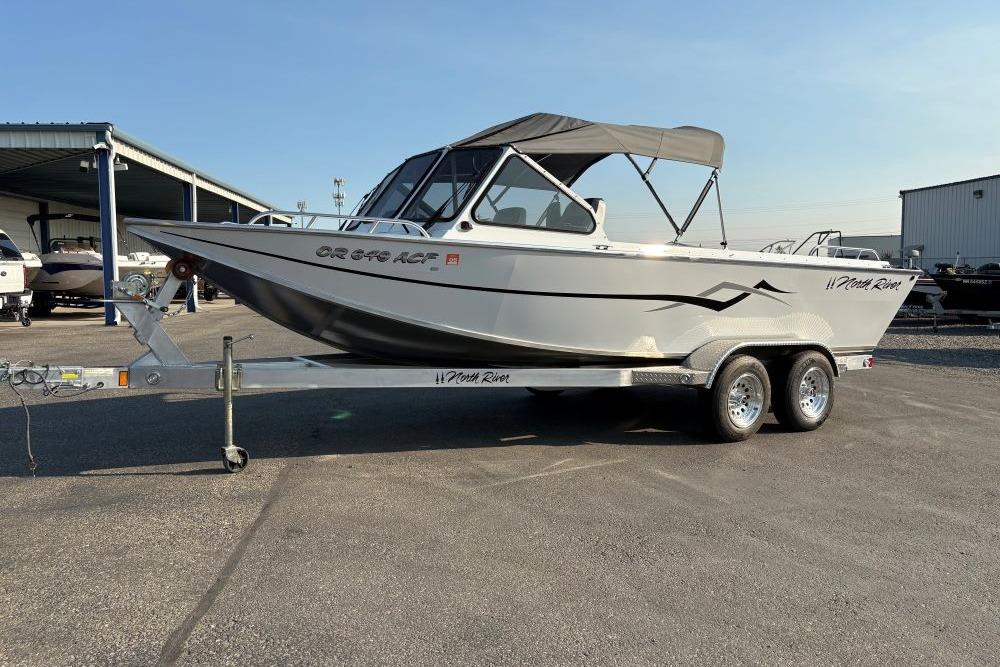 North River 21 COMMANDER 212 PUMP 2006 North River 21 Commander 212 Pump boat on trailer, parked outdoors.
