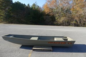 Tracker Grizzly 14 Jon 2026 Tracker Grizzly 14 Jon boat on pavement, surrounded by autumn trees.