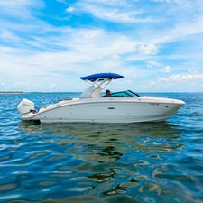 Sea Ray SDX 270 Outboard 2019 Sea Ray SDX 270 Outboard boat cruising on a sunny day.