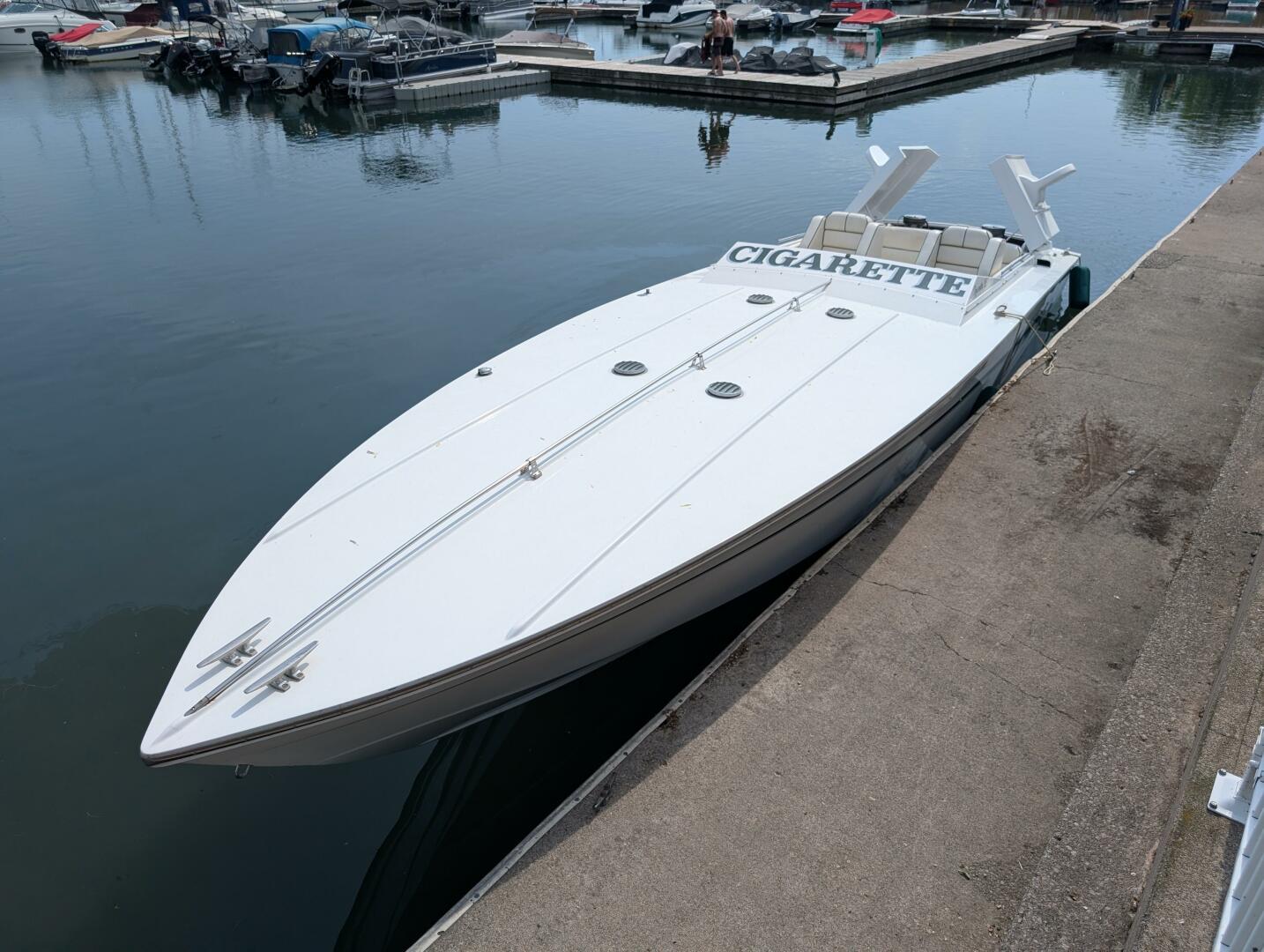 Cigarette 36 1978 Cigarette 36 speedboat docked at marina, sleek white design.
