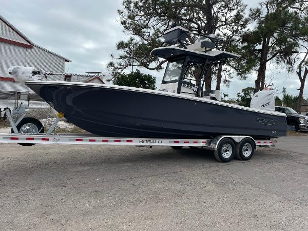 Robalo 266 Cayman SD 2025 Robalo 266 Cayman SD boat on trailer, parked outdoors.