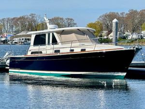 Sabre 42 Salon Express 2017 Sabre 42 Salon Express yacht docked in a serene marina setting.