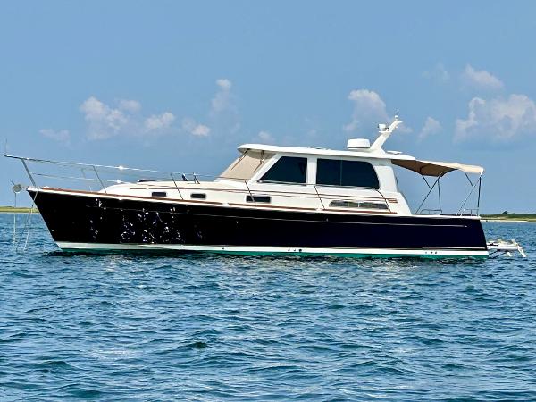 Sabre 42 Salon Express 2017 Sabre 42 Salon Express yacht on calm blue water under clear sky.