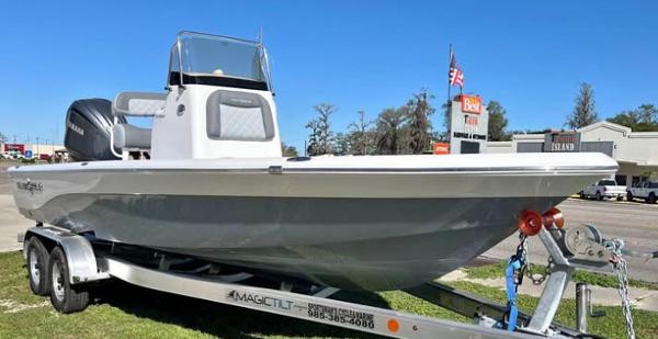 NauticStar 224 Bay 2025 NauticStar 224 Bay boat on trailer, parked outdoors.