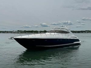 Cruisers Yachts 540 Express 2003 Cruisers Yachts 540 Express on calm water under cloudy sky.