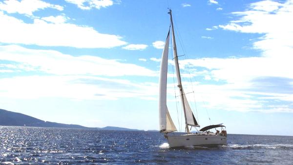 Bavaria 39 Cruiser Sailing Bavaria 39 Cruiser, 2006 model, on open sea under clear blue sky.
