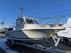 Defiance Admiral 220 EX 2025 Defiance Admiral 220 EX boat on trailer, parked outdoors.