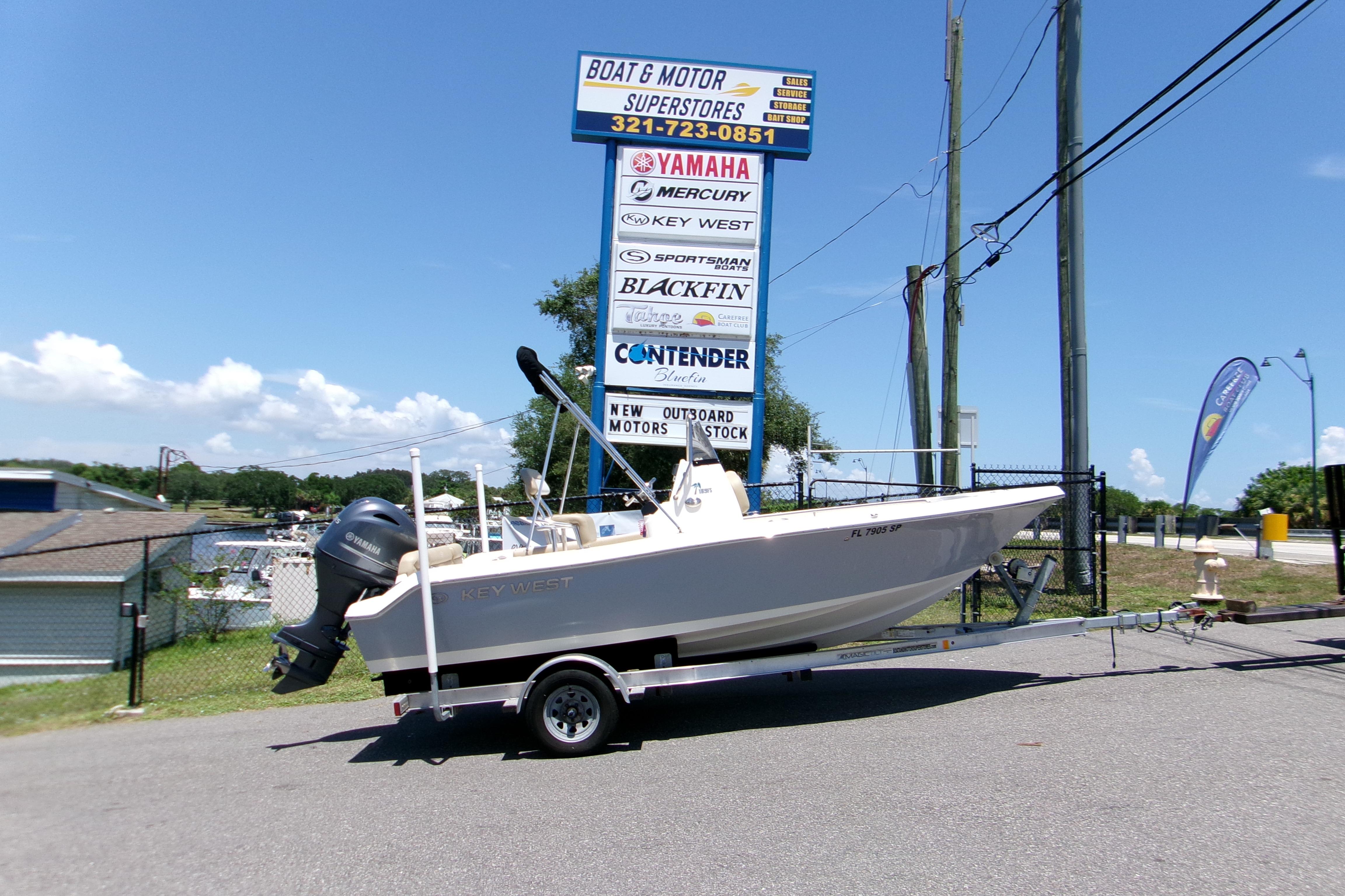 Key West 189 FS 2020 Key West 189 FS boat on trailer at dealership under clear blue sky.
