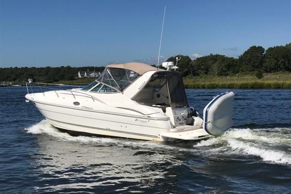 Cruisers Yachts 320 Express 2006 Cruisers Yachts 320 Express boat cruising on a sunny day.
