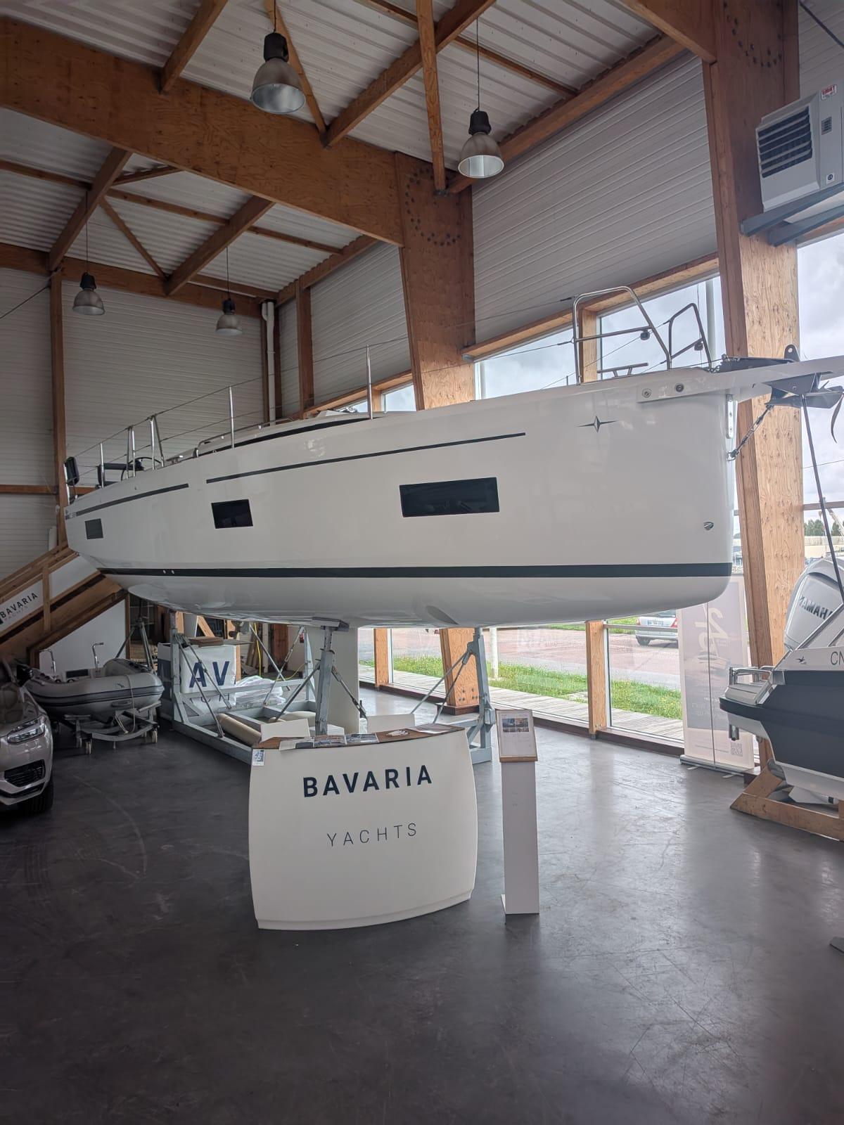 Bavaria C38 2025 Bavaria C38 yacht displayed indoors at a showroom.