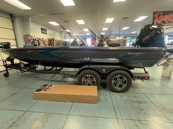 Triton 21 XrT 2023 Triton 21 XrT boat on display in showroom.