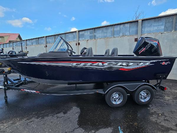 Tracker Targa V-18 WT 2023 Tracker Targa V-18 WT fishing boat on trailer, black with red accents.