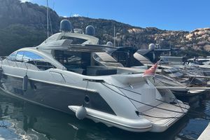 Azimut 68S Luxury 2006 Azimut 68S yacht docked in scenic marina setting.