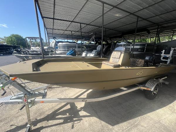 G3 Gator Tough 17 CC 2025 G3 Gator Tough 17 CC boat on trailer under a metal canopy.