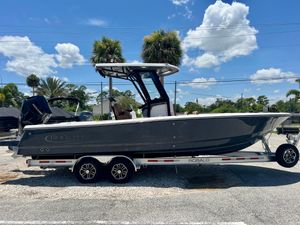 Robalo 266 Cayman 2025 Robalo 266 Cayman boat on a trailer under a clear blue sky.
