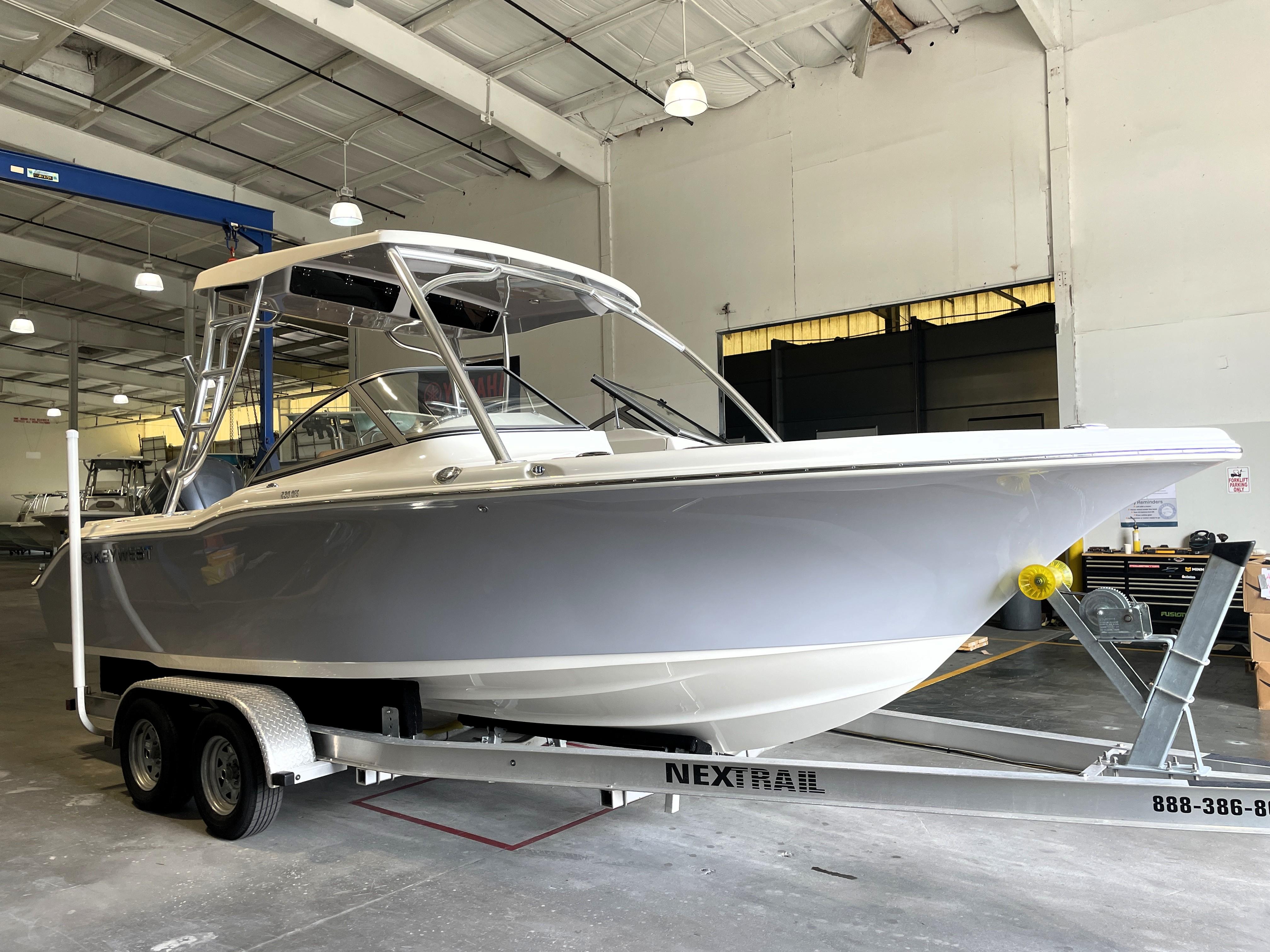 Key West 239 DFS 2025 Key West 239 DFS boat on trailer in indoor storage facility.