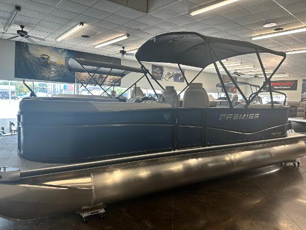 Premier 220 Sunscape 2025 Premier 220 Sunscape pontoon boat displayed in a showroom.