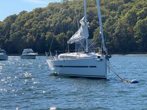 Dufour Performance 36 Sailboat Dufour Performance 36, 2012 model, anchored on a sunny lake with forested background.