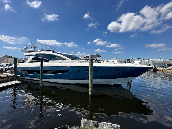 Cheoy Lee Alpha 87 Express Sportbridge 2014 Cheoy Lee Alpha 87 Express Sportbridge yacht docked under a clear blue sky.