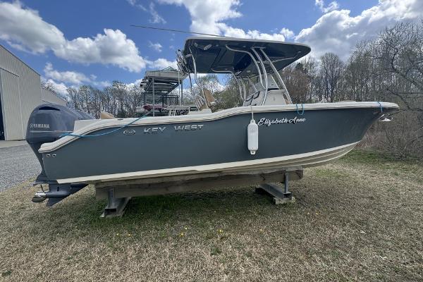 Key West 263 FS 2018 Key West 263 FS boat on display outdoors under a partly cloudy sky.