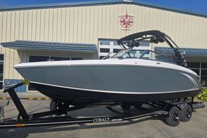 Cobalt R5 Surf 2019 Cobalt R5 Surf boat on trailer outside marine building.