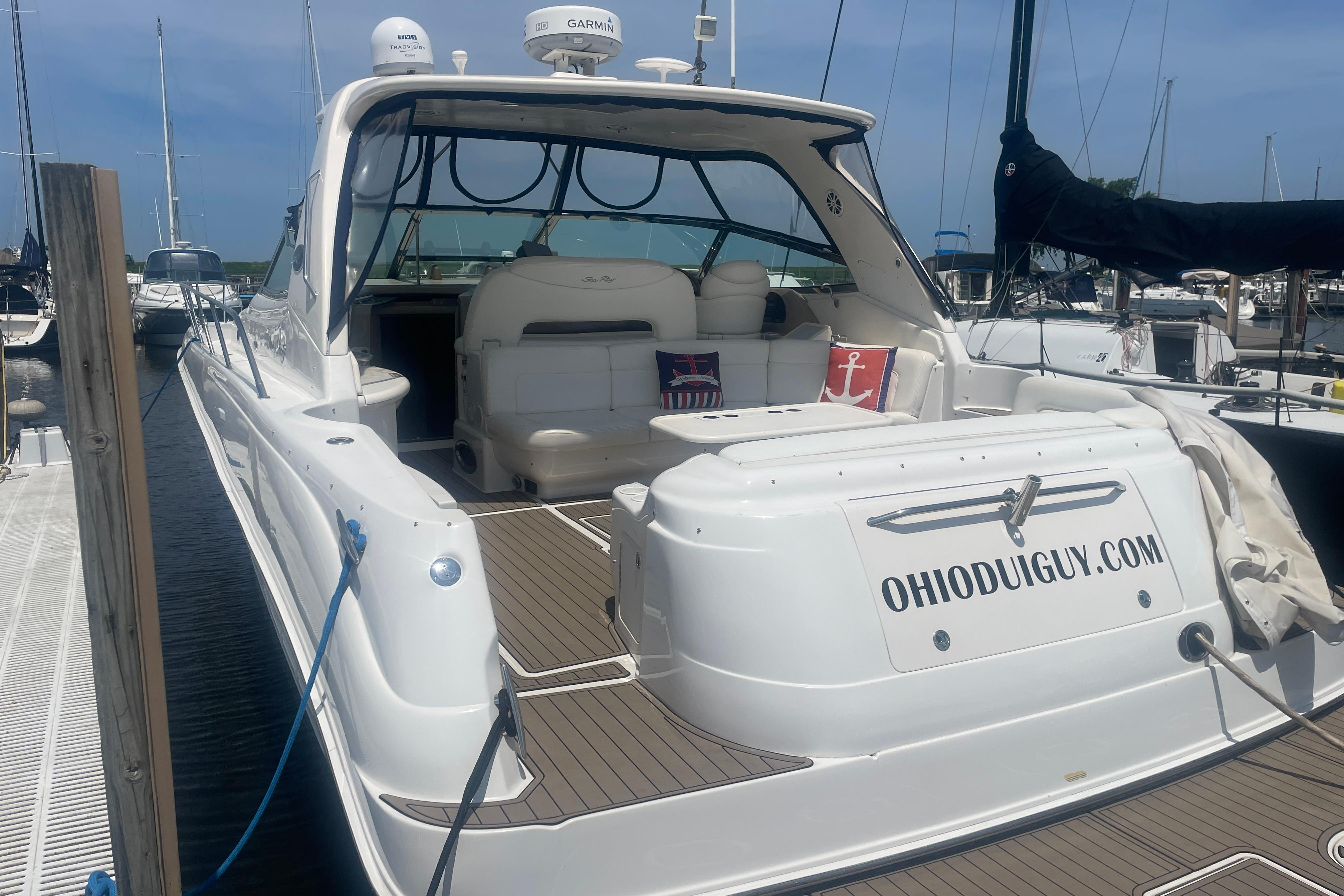 Sea Ray 460 Sundancer 2001 Sea Ray 460 Sundancer yacht docked, featuring spacious seating and custom website branding.