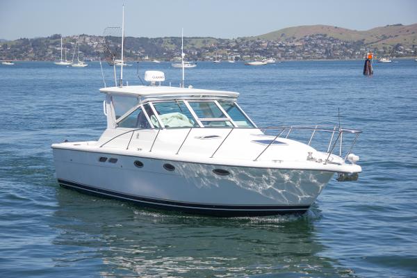 Tiara Yachts 3100 Open 2002 Tiara Yachts 3100 Open cruising on a calm, scenic bay.