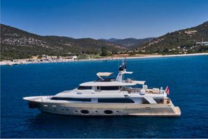 Custom Line Navetta 33 Luxurious 2010 Ferretti Yachts Navetta 33 cruising in scenic coastal waters.