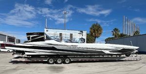MTI 52RP 2018 MTI 52RP speedboat on trailer, parked outdoors under blue sky.