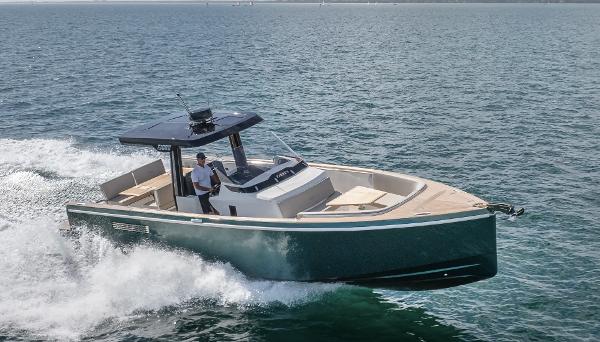 Fjord 38 2023 Fjord 38 motor yacht cruising on open water, showcasing sleek design and performance.