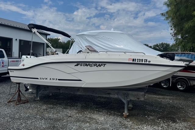 Starcraft SVX 191 OB 2024 Starcraft SVX 191 OB boat on display, white exterior, parked outdoors.