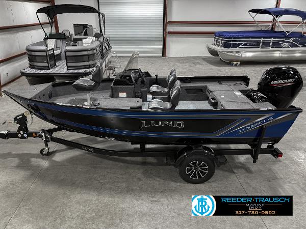 Lund 1775 IMPACT XS SINGLE 2025 Lund 1775 Impact XS fishing boat in showroom, featuring Mercury outboard motor.