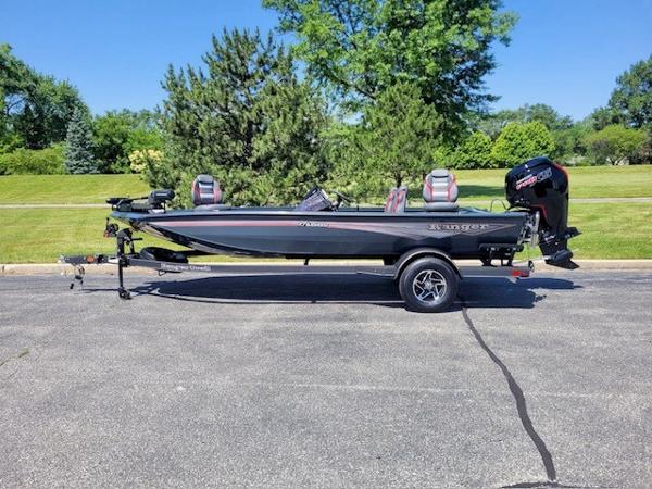 Ranger RT188P 2024 Ranger RT188P fishing boat on trailer, parked outdoors.